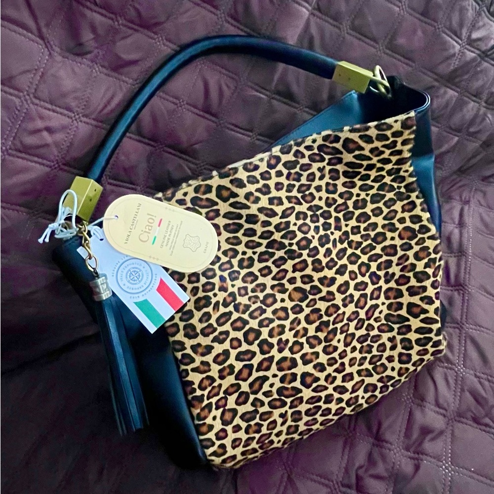 Viola Castellani Italian
leather and fabric leopard purse/ handbag.